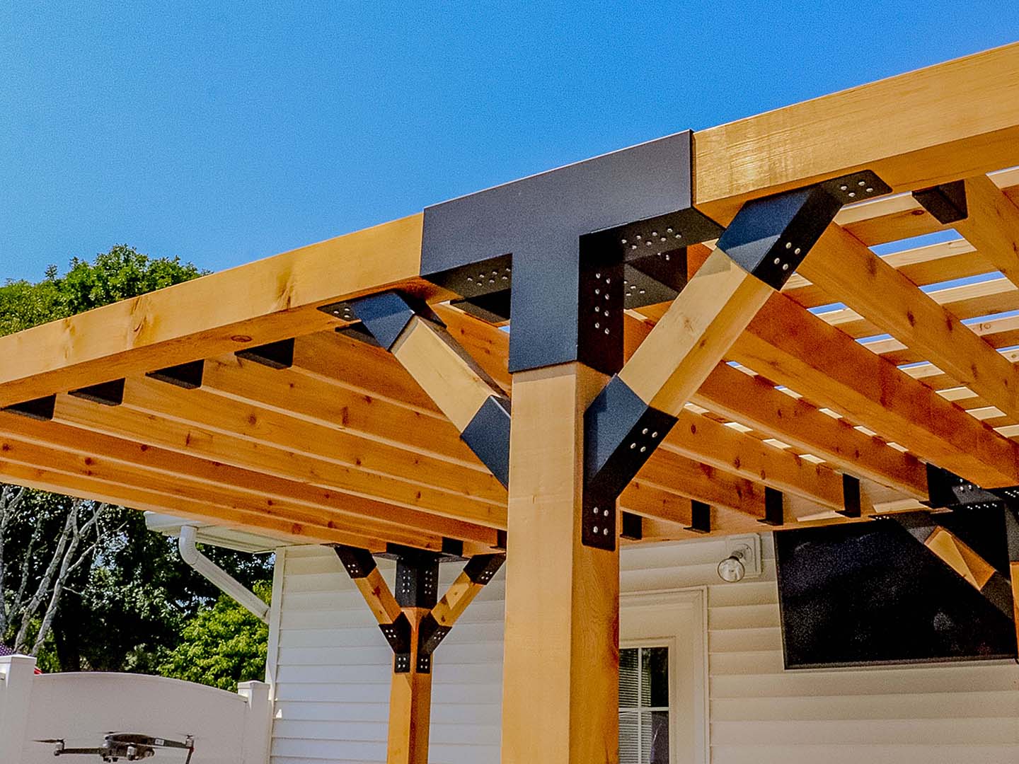 Modern Pergola with Custom Black Bracket Accents in Cedar Falls